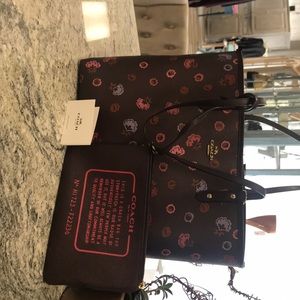 Coach Tote with separate pouch.